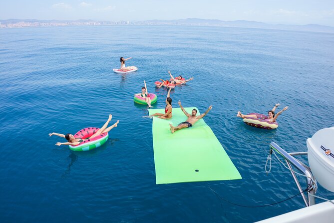 Barcelona Catamaran Cruise with Tapa & Drink Included - Daytime sailing and the 30-minute swim stop