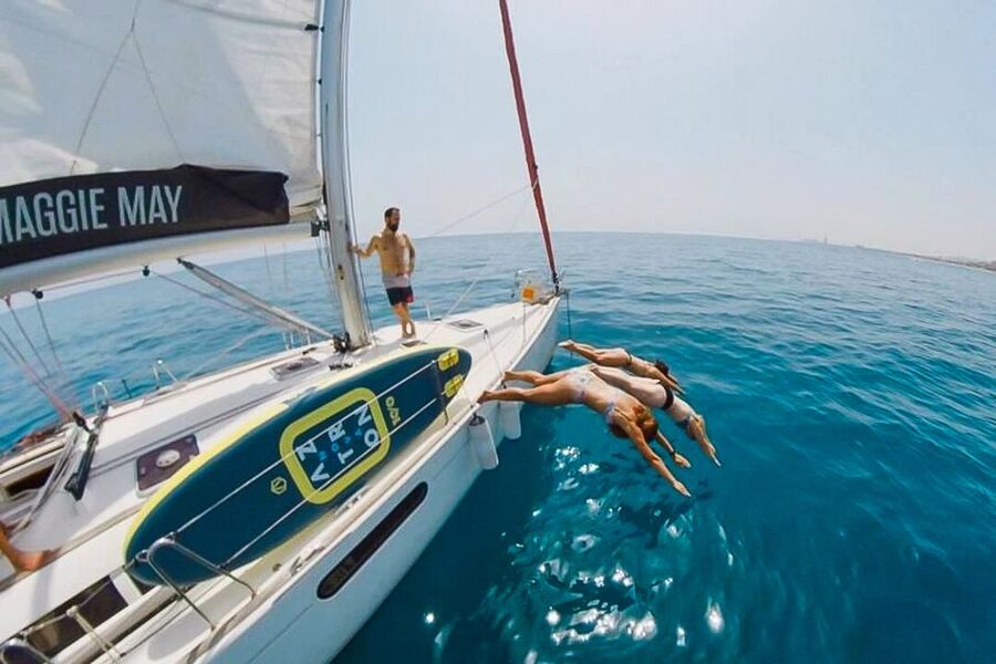 Barcelona: Coastline Boat Trip with Snacks and Cava - The swimming stop in Mediterranean water