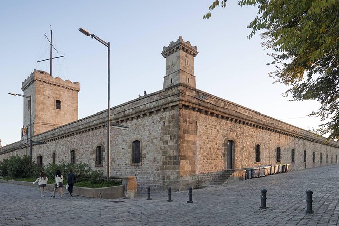 Barcelona: Old Town, Montjuic Castle, Cable Car Small Group Tour - Taking the funicular toward Montjuïc