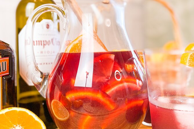 Barcelona Paella Cooking Class & Boqueria & Hofmann-Trained Chefs - Pan con tomate, jamón, and a glass of cava