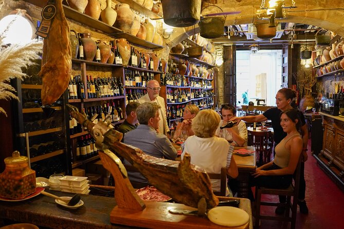 Barcelona Tapas and Wine Experience Small-Group Walking Tour - Croquetas, patatas bravas, and cava