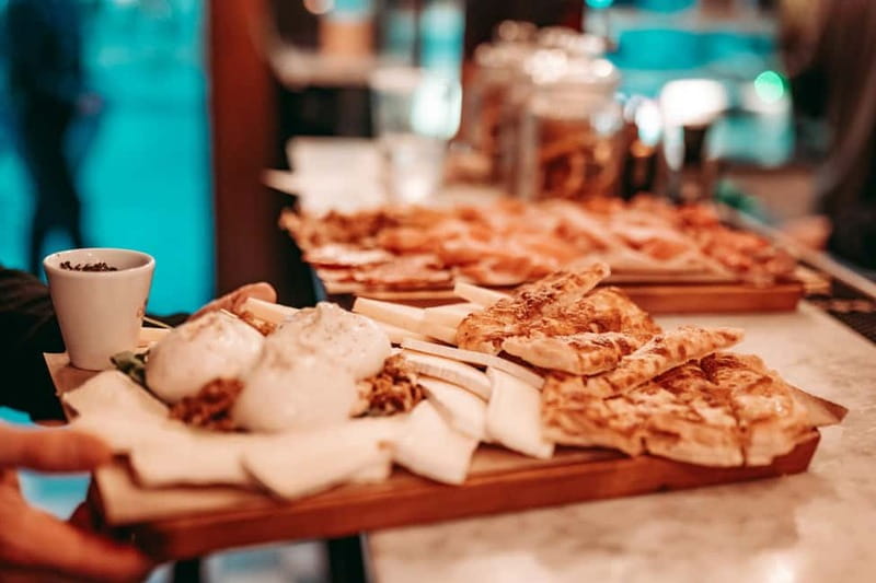 Barcelona: Tipsy Tapas & History Tour in the Gothic Quarter - Timing, cancellation, and the finish near La Rambla