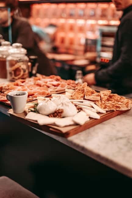 Barcelona: Tipsy Tapas & History Tour in the Gothic Quarter - First stop: two traditional tastes in a tucked-away bar