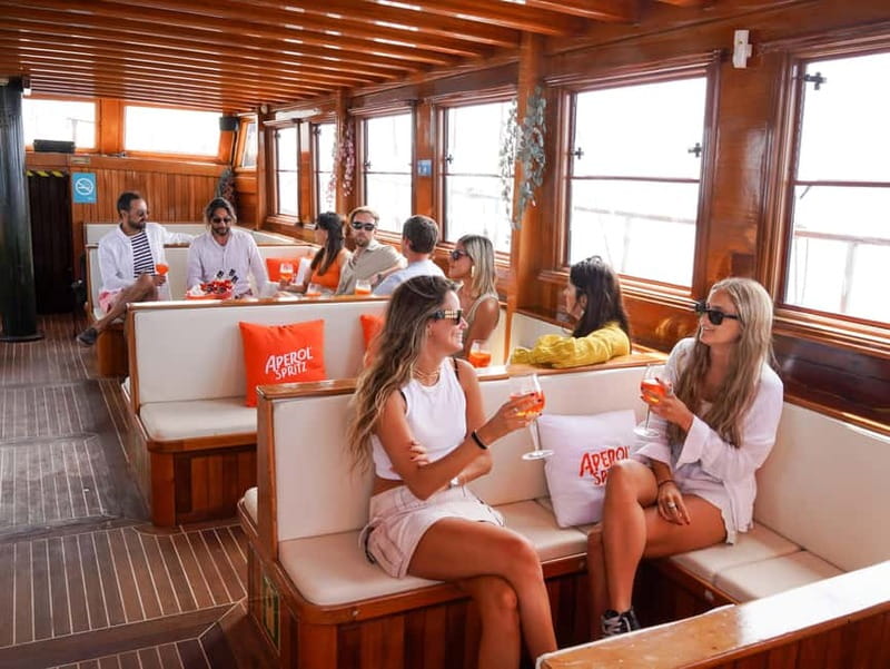 Barcelona: Wooden Boat Sailing with Tapa and Welcome Drink - Music, mood, and the social side