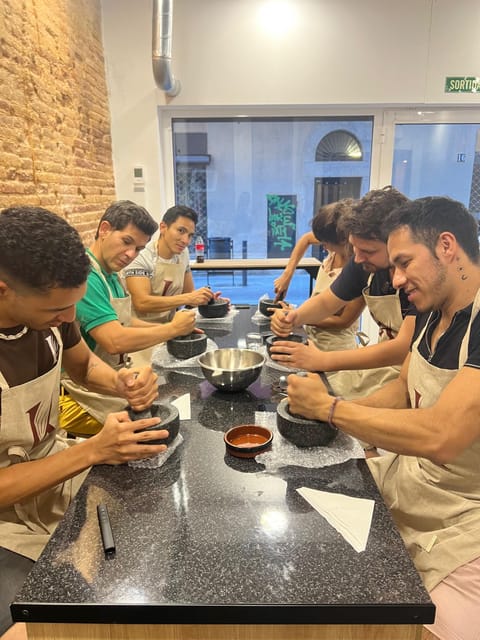 Bean to Bar Chocolate Workshop in Barcelona - Grinding beans into cocoa paste