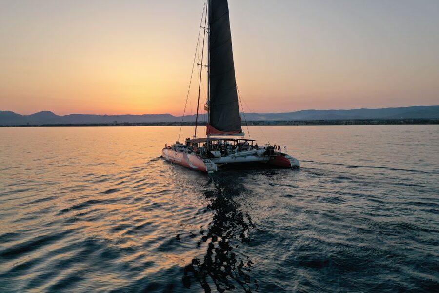 Cambrils: Sunset Catamaran Cruise with Drinks - Anchoring near Mont-roig for a swim