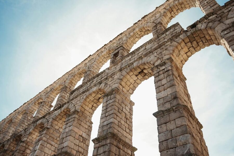 From Madrid: Half-Day or Full-Day Trip to Segovia - Starting beneath Segovia’s Roman aqueduct