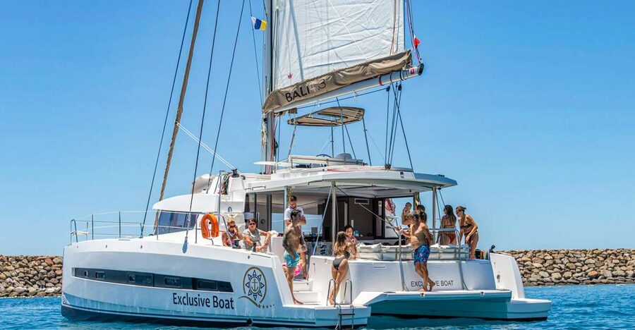 Gran Canaria: Catamaran Day Trip with Food and Drinks - The first stop is for swimming, snorkeling, and shared water gear
