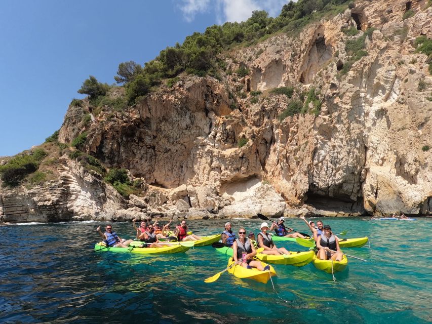 Granadella: Caló, Cova Llop Marí, and Ambolo Kayak Trip - Entering Llop Marí Cave by kayak