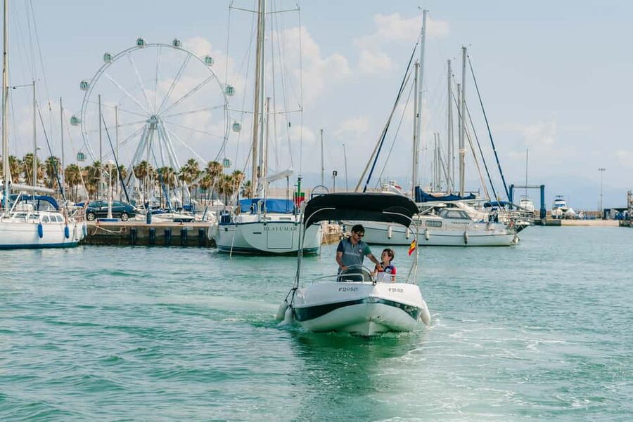 Malaga: Boat Rental without a License for Dolphin Watching - Following the Malaga coast and finding a cove