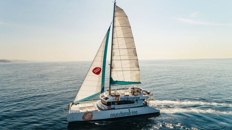 Malaga: Catamaran Sailing Cruise with Swimming & Optional DJ - Leaving the pier and finding your place on deck