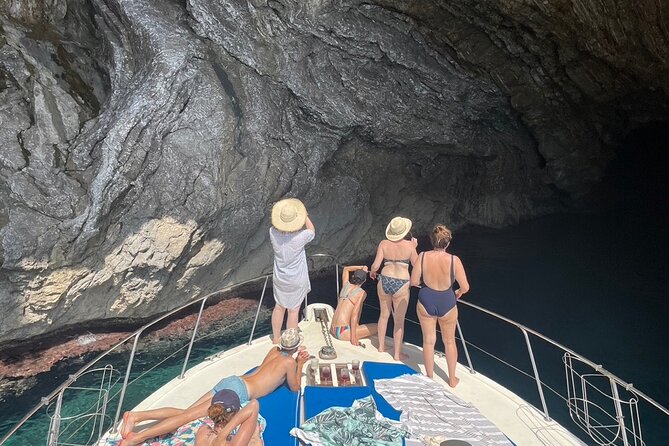 Mallorca Beach & Caves 4hr Boat Trip Drinks, Tapas, SUP & Snorkel - Sea caves and cliffs viewed from the water