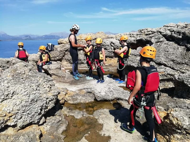 Mallorca Half-Day Coasteering Experience - Abseiling down a cliff toward the water