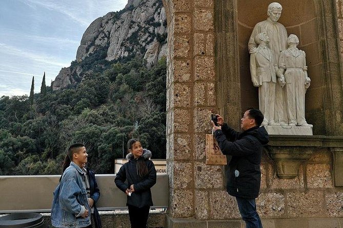 Montserrat Day Trip Private or Small Group with Basilica Tickets - Entering the basilica to see La Moreneta