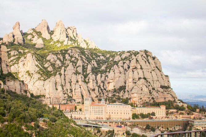 Montserrat Full Day Tour with Farmhouse Lunch and Winery Visit - The cogwheel train down the mountain