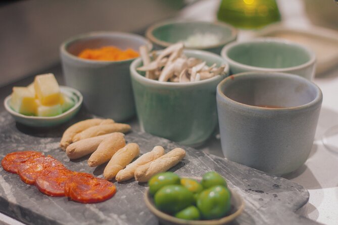 Paella Cooking Class in Madrid with Bottomless Wine Pairing - Snacks and Spanish dishes during the lesson