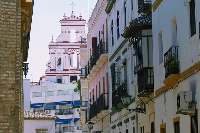 Sevilla Food Tour: Tapas, Wine, History & Traditions - Chicharrones, montaditos, and beer at Los Soportales