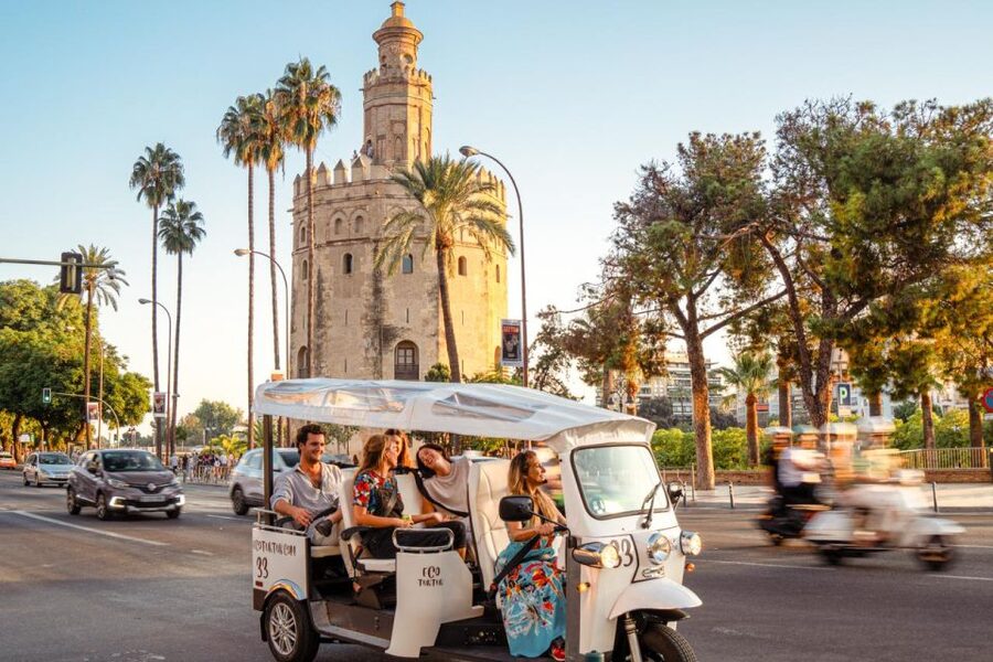 Seville: Private City Tour by Eco Tuk Tuk - Along the river to the Torre del Oro