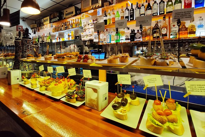 Spanish Wine and Tapas Tour in a Local Neighborhood in Barcelona - Seating, heat, and the practical side of local bars