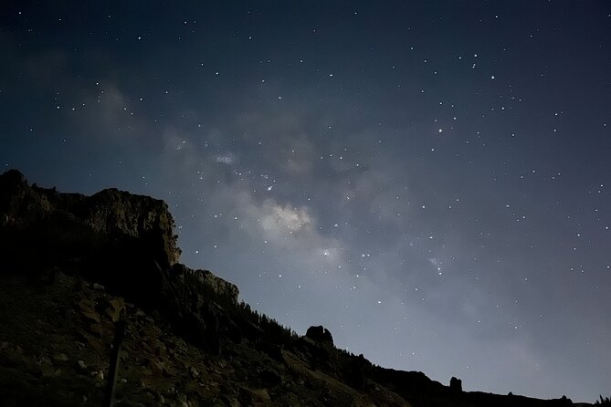 Sunset & Stargazing Experience From Teide - Sunset over volcanic rock and the cloud layer