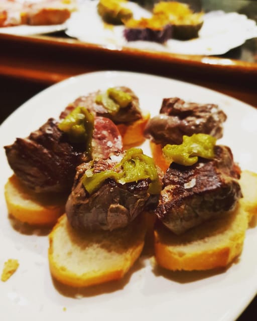 The Original Bilbao Food Tour with Wine Pairings - Starting at the KFC and entering old Bilbao